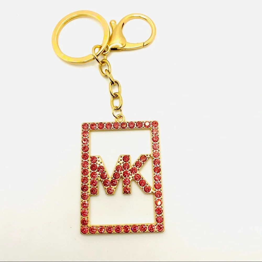 Purse Charm Key Chain MK Pink Crystals set in golden tone. BRAND NEW